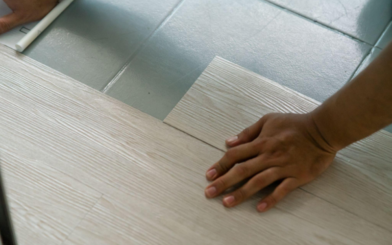 Manually installing vinyl flooring over the ceramic tile