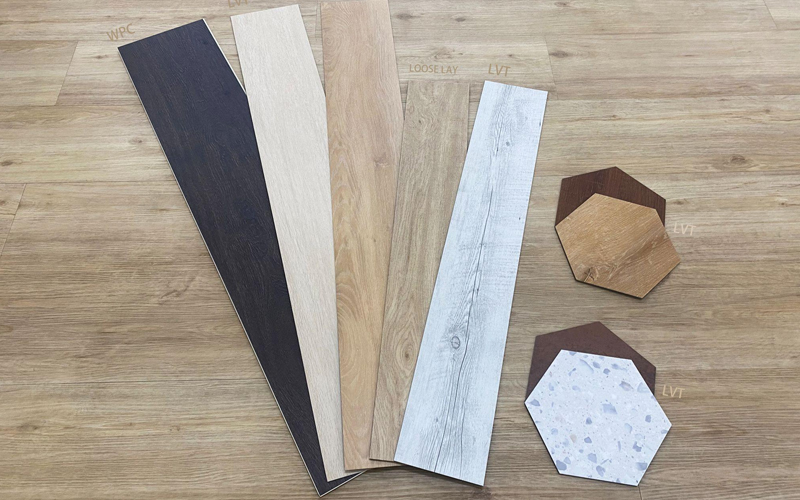 Various vinyl flooring samples displaying different types, patterns, and shapes.